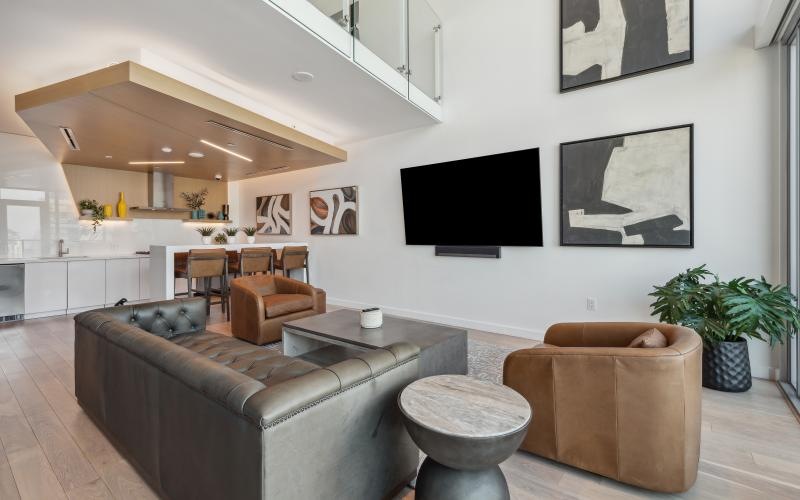a living room with a tv and couches