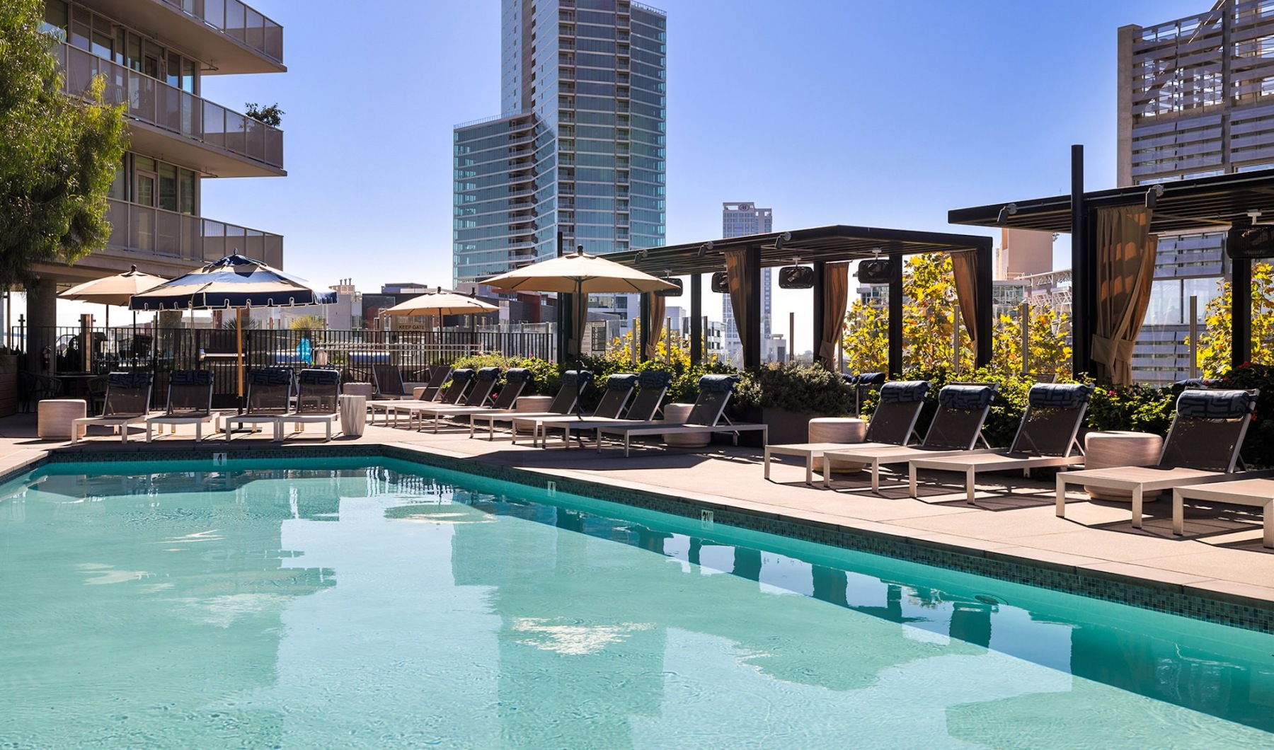 Resort-style swimming pool with lounge seating